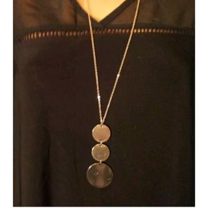 Long goldtone necklace. 3 round pendants. Very stylish. NWT.